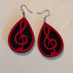 Faux leather music note earrings on sterling silver hooks.